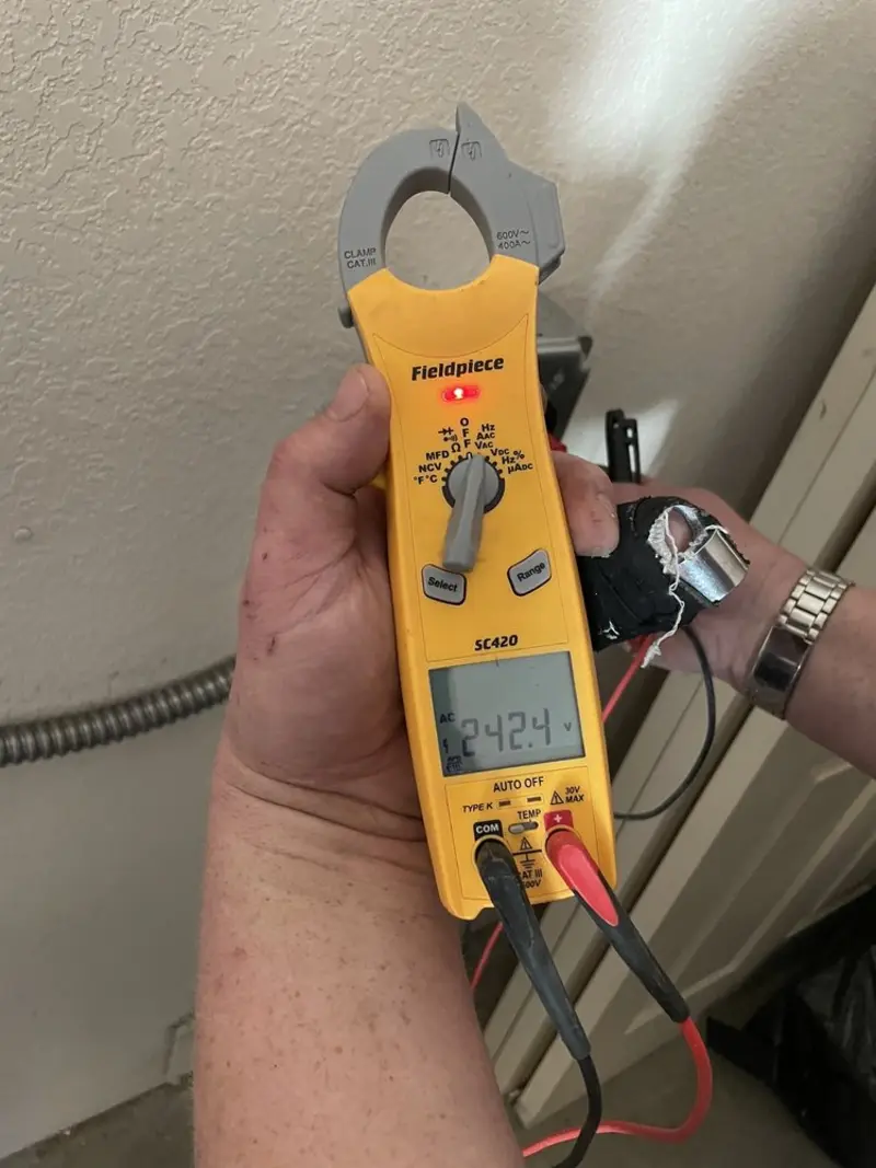 Voltage testing with clamp meter during Aluminum Wiring Replacement in Spencer
